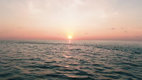 drone fly over the water maldives sunset beach