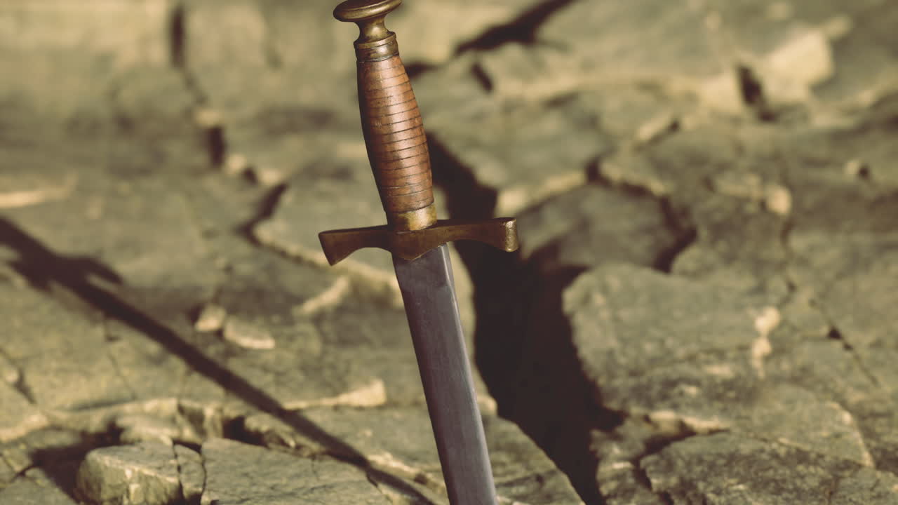 Sword stands alone in a fissure of cracked earth during twilight hours