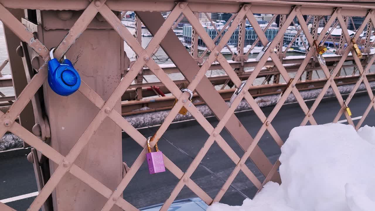 Close-up of padlocks on fence on new york bridge.