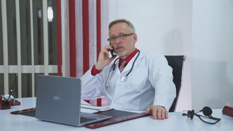 doctor talking on the phone in the office