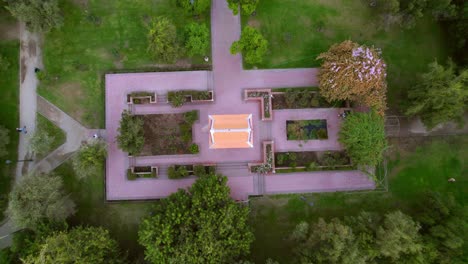 Aerial-topdown-view-of-Thailand-Plaza-at-Araucano-Park,-Asian-Pagoda-monument,-Santiago