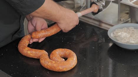 using a sausage stuffer to make hungarian sausage