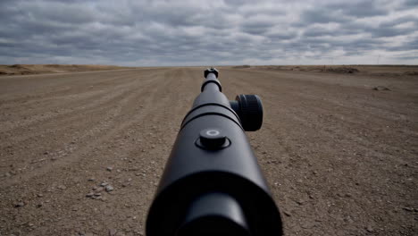 remote dirt road view through a monocular