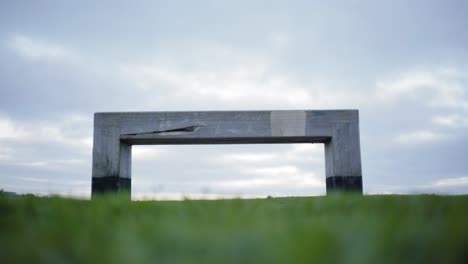 wooden-bench-grey-colour-in-the-park-with-lawn-and-sky