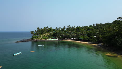 Aerial-view-toward-the-Club-Santana-Beach-and-Resort,-sunny-day-in-Sao-Tome