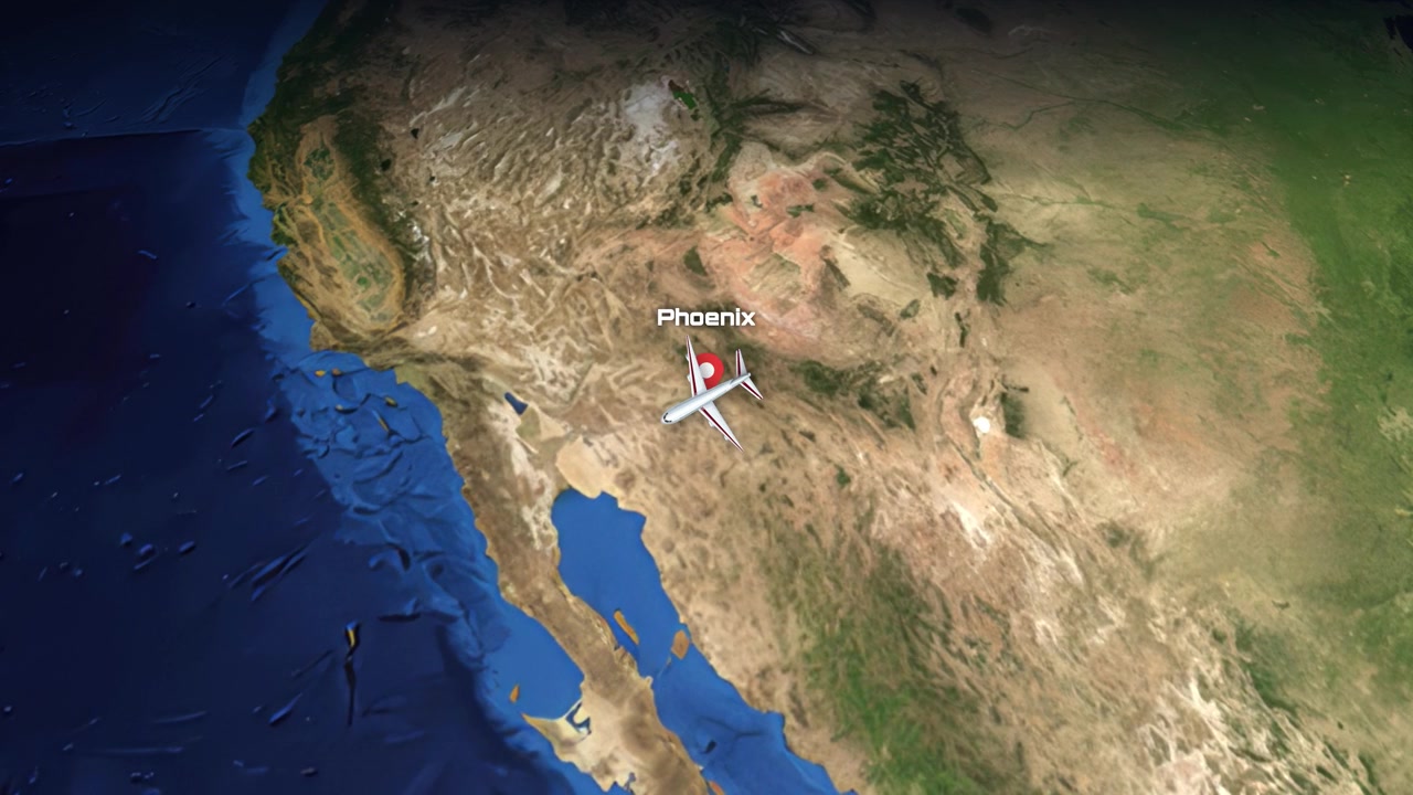 Satellite view animation tracks a commercial airplane flying from Toronto across North America to Phoenix