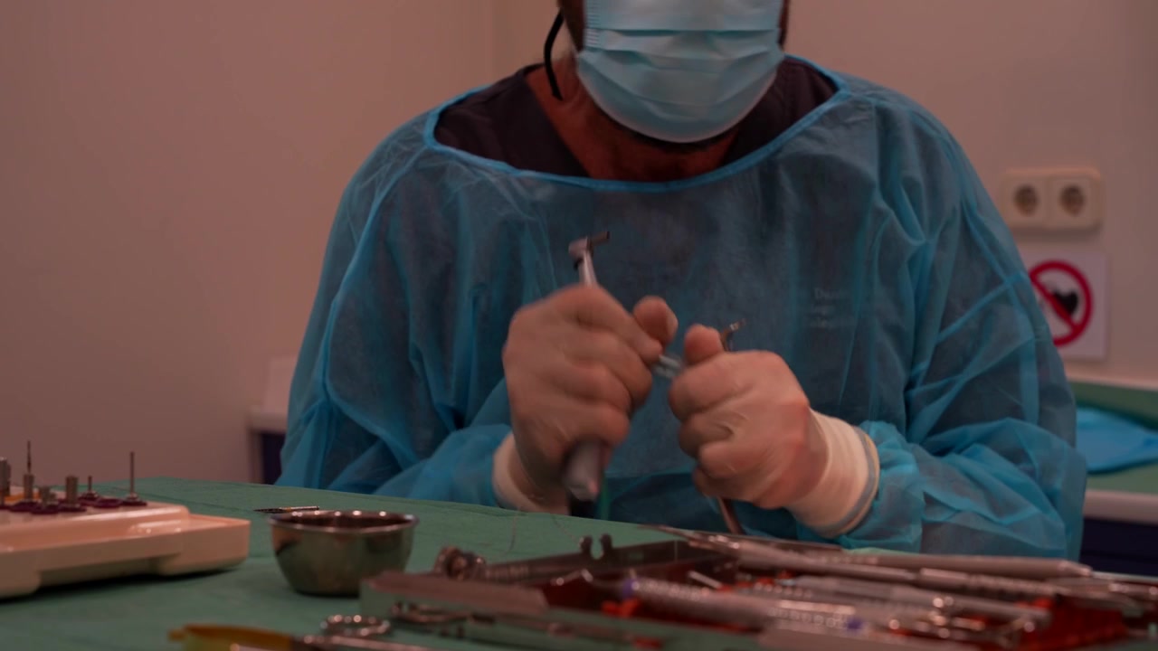 Rack focus of dentist adjusting tools for procedure, professional setup in clinic
