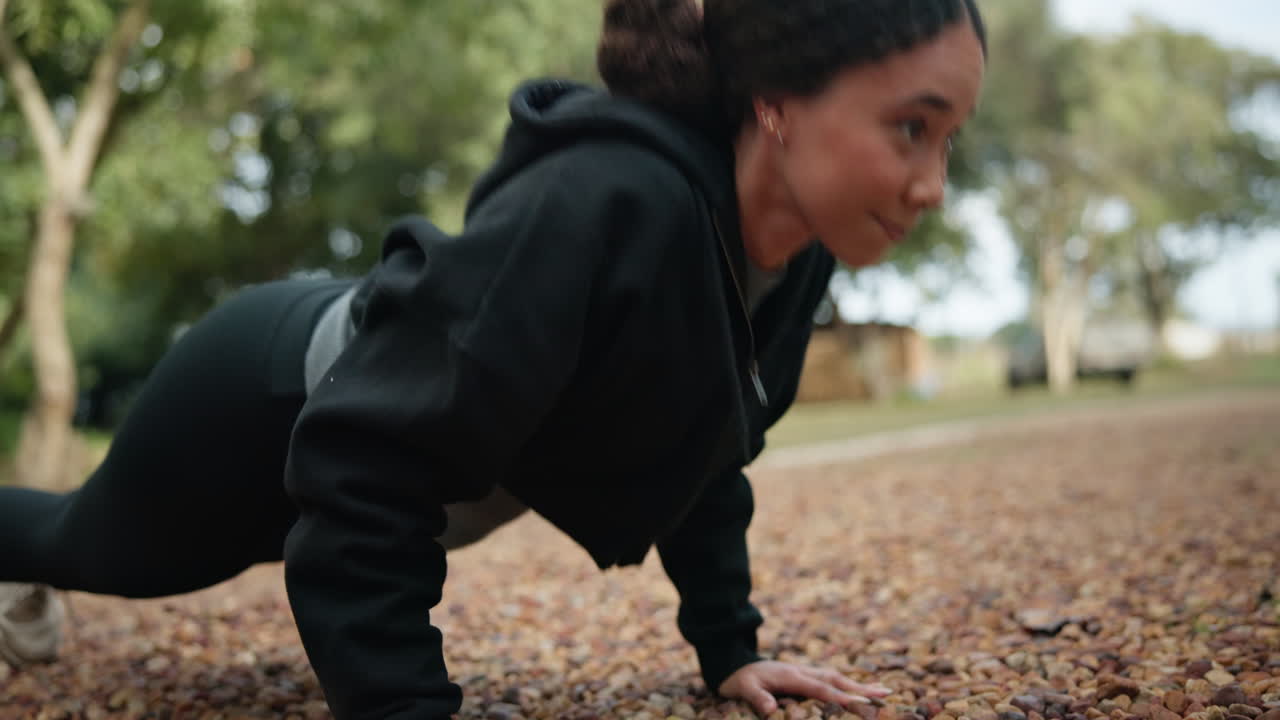 Woman, fitness and push ups in nature for workout