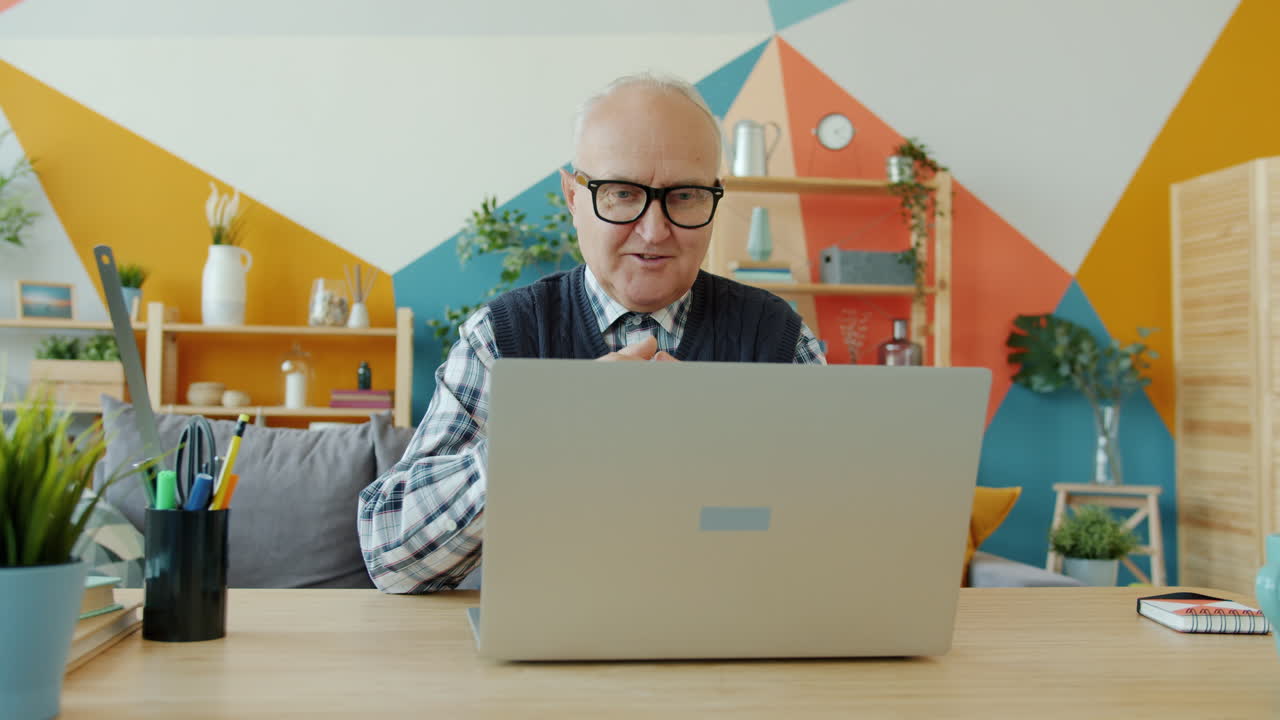Senior Man Using Laptop for Video Call