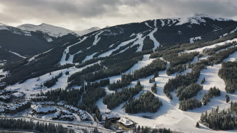 long shadows of trees over the ski slopes at the copper mountain
