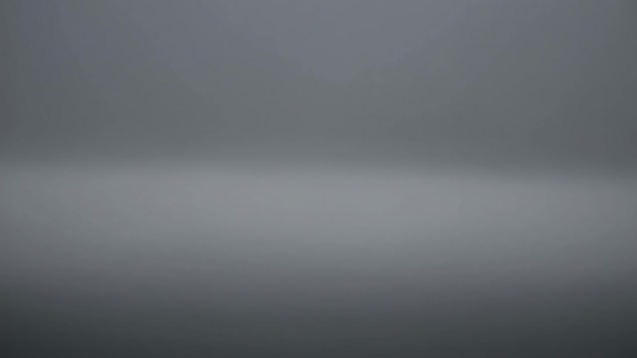 Smooth gray gradient background creating a calming and serene atmosphere, ideal for presentations, websites, or any design project requiring a simple yet elegant backdrop