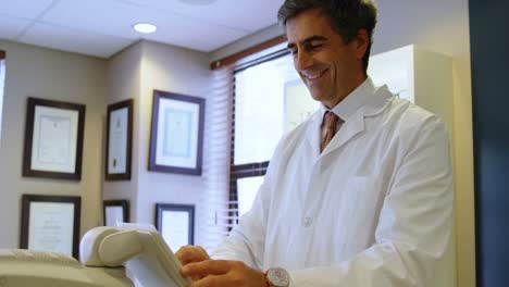 optometrist examining patient eyes with autorefractors 4k