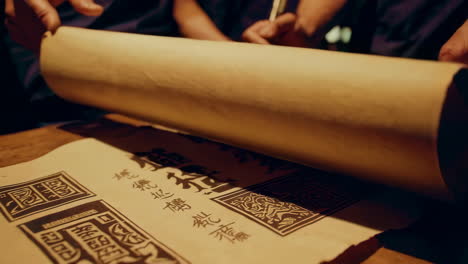 ancient chinese scholars studying scrolls in a grand library