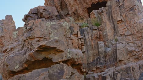 Rocky-mountain-cliff-side-in-Teide-national-park-area,-tilt-up-view