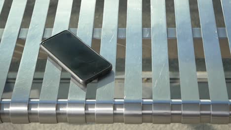 lost phone on metal bench