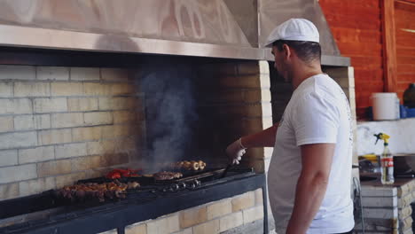chef preparing food. portrait of serious man working at restaurant