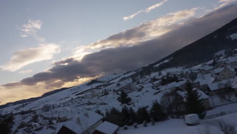 Portrait-of-young-caucasian-man-smiling-looking-out-train-window-snowy-landscape