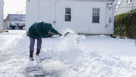 shoveling snow in the winter