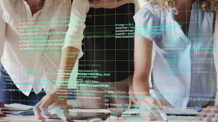 Grid appearing, overlaying table and hands three women reviewing business notes and writing
