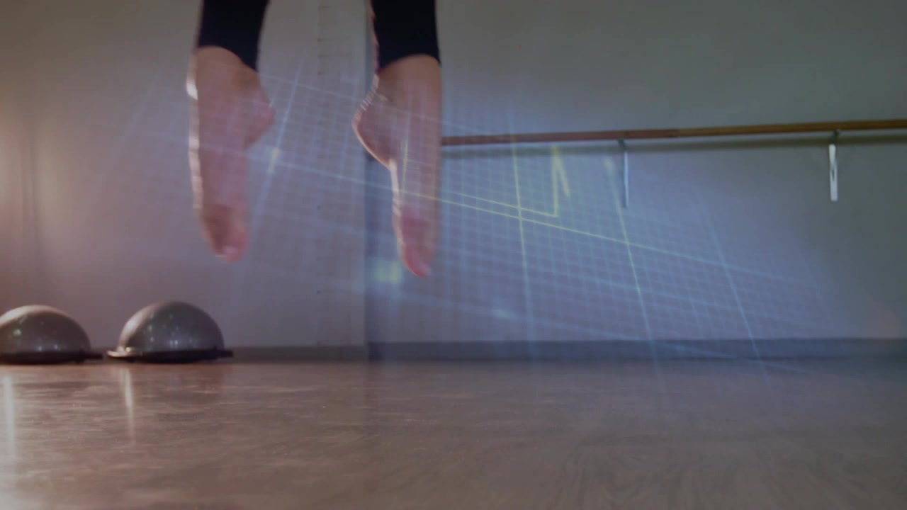 Female-dancer shifting weight onto demi-pointe, launching jump while training, lens flares sweeping