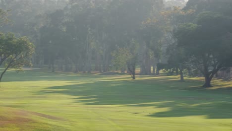 A-beautiful-golf-course-during-sunset.-Pan-shot