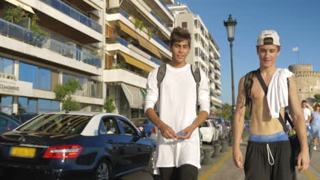 Happy-teenager-friends-walking-city-waterfront