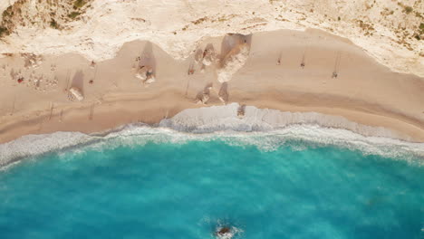 Blue-Ocean-Waves-Coming-Into-Sandy-Shore-Of-Porto-Katsiki-Beach-In-Lefkada,-Greece