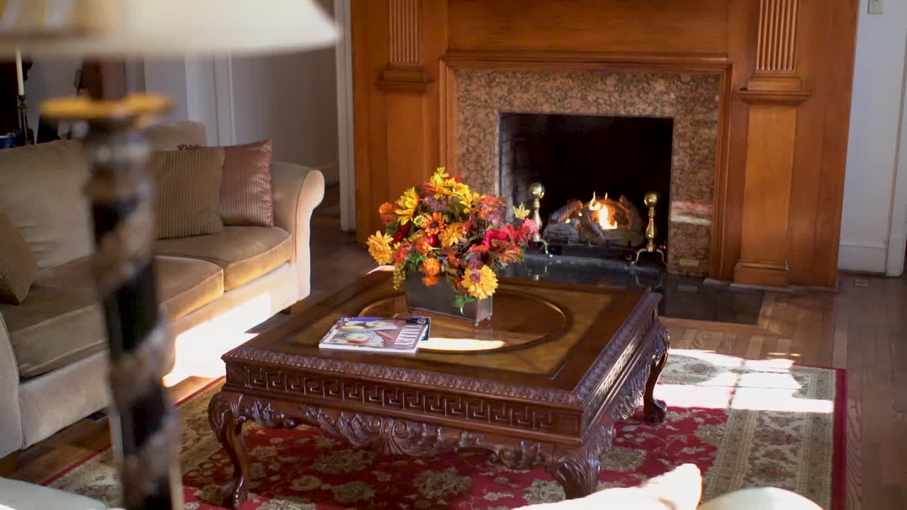 Living Room Interior with Fireplace and Floral Arrangement