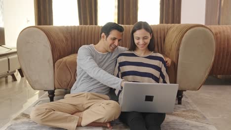 happy indian wife explaining the plan to husband