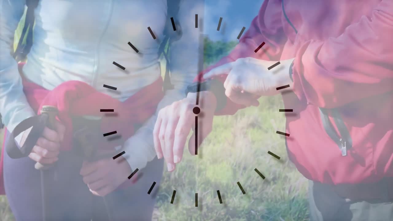 백인 커플의 중간 섹션 시골에서 하이킹, 시계를 확인, 빠르게 움직이는 시계 표시