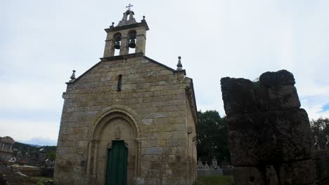 old church of san paio de albán with arched green door, located in coles, galicia, spain
