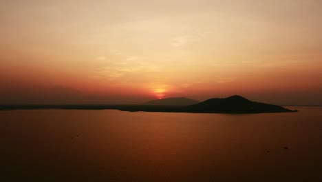 Majestic-Mountains-and-Calm-Waters-Aerial-Perspective-of-Nature's-Beauty-at-Sunset