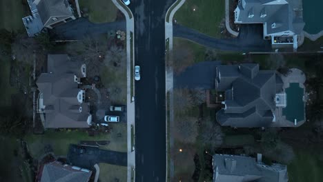 aerial top down shot of luxury american neighborhood with private street and cul-de-sac