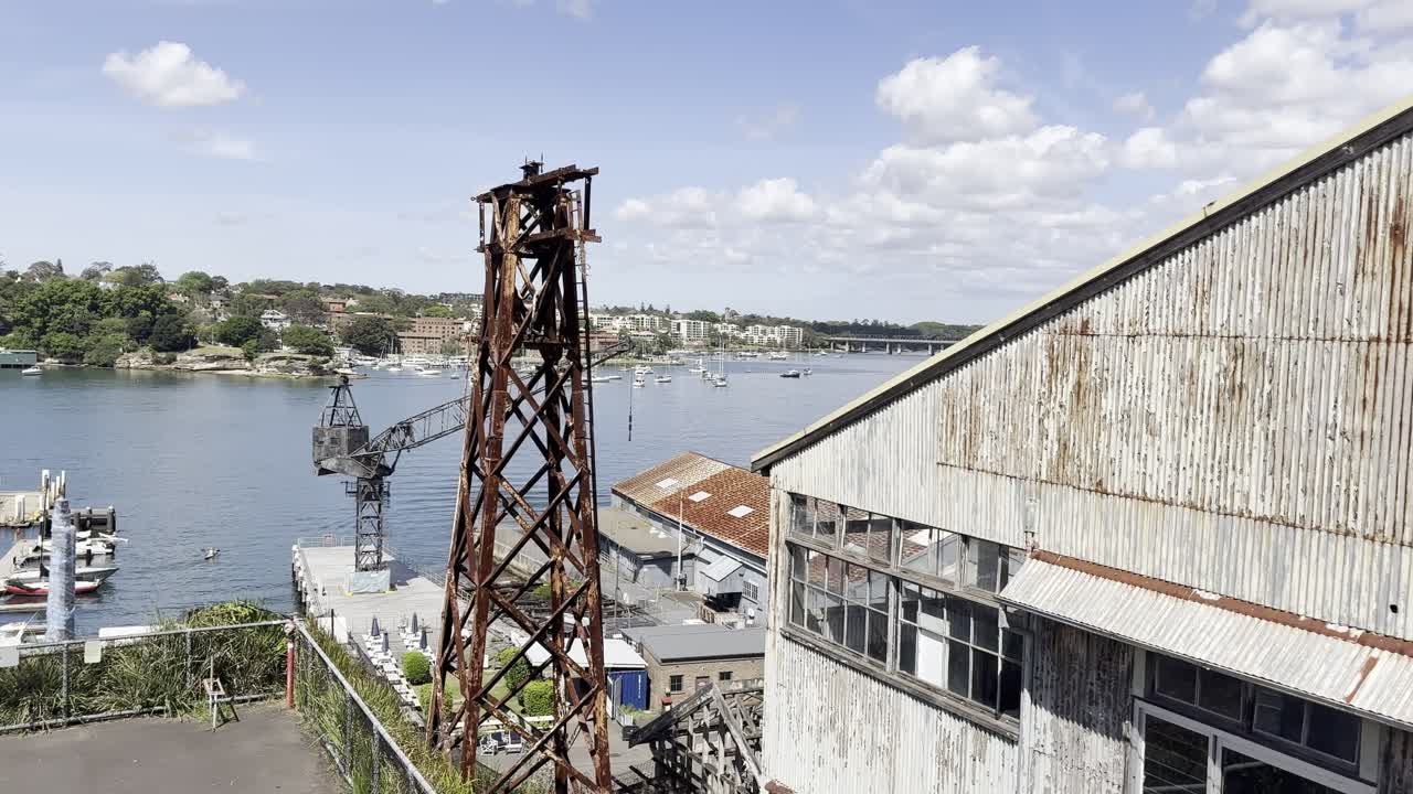 Rusty iron infrastructure, buildings and cranes on the historical industrial Cockatoo Island in Sydney harbour, Australia