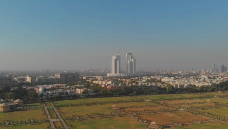 aerial flyover nooruddin zangi park with com3 mall in distance