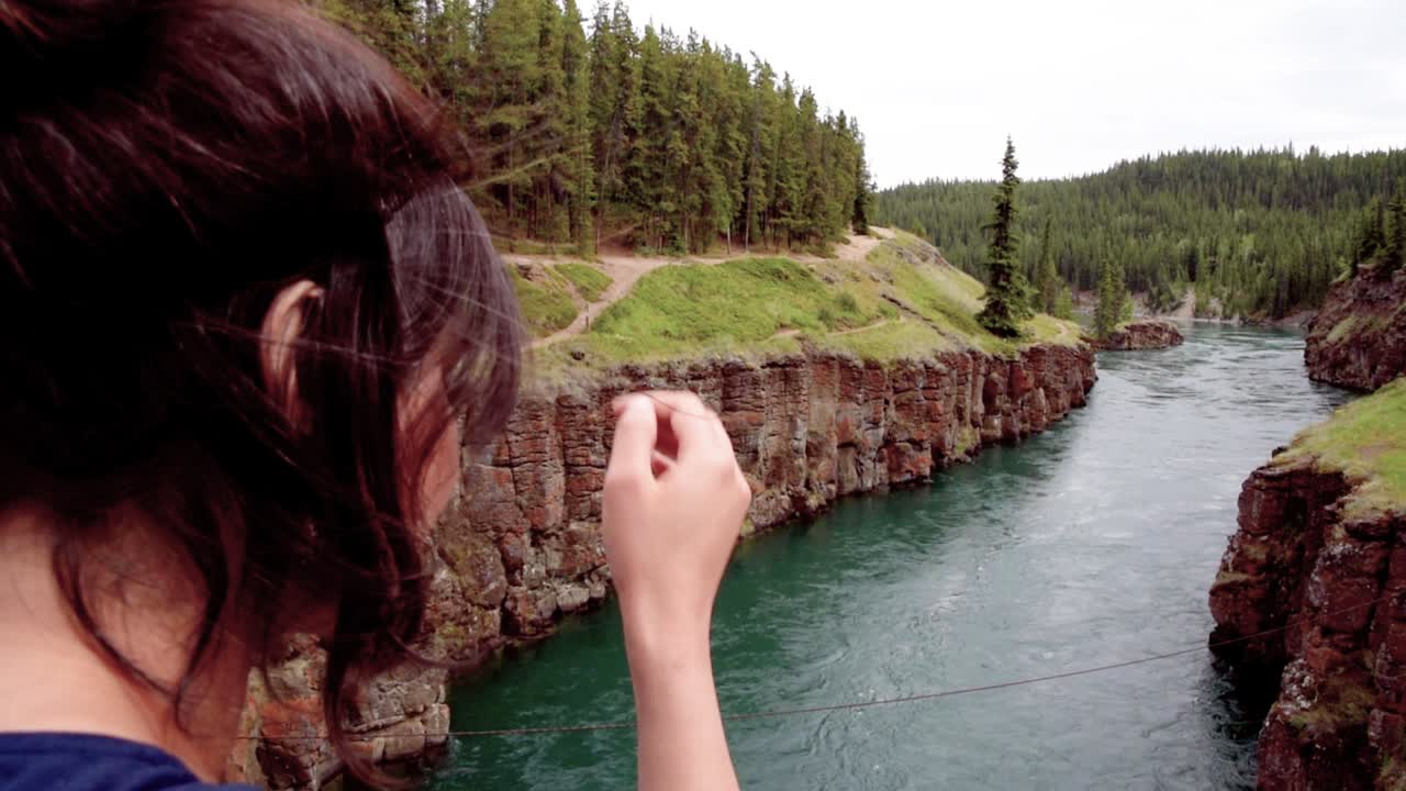 Indian woman fresh air at Yukon River, Miles Canyon, close up
