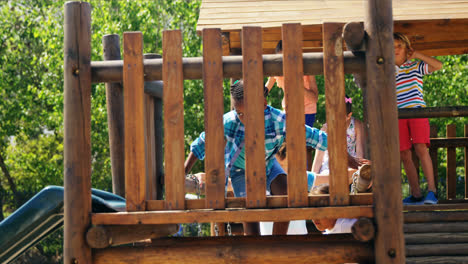 schoolgirl playing on slide in playground