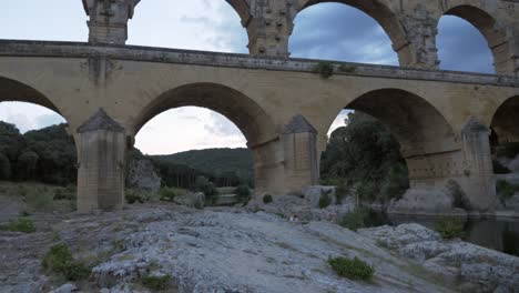 close up pont du gard aqueduct with river gardon in southern france