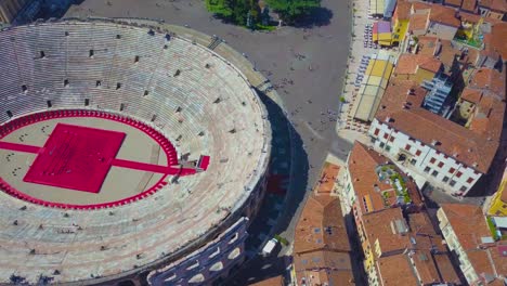 aerial view of arena di verona, italy. the drone flies over the arena and over the houses of the city. a view of the arena and the city opens.