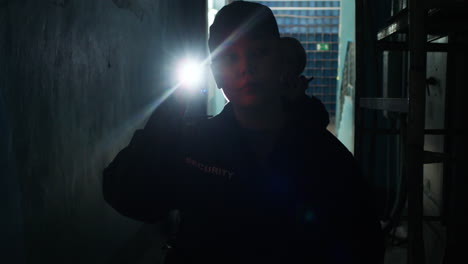 female safety guards with flashlight in a warehouse