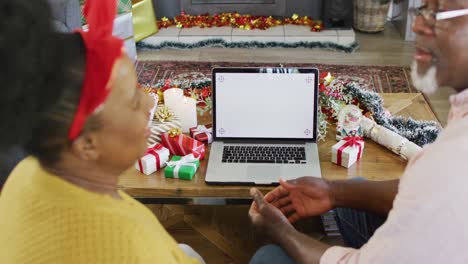 senior african american couple having laptop video call