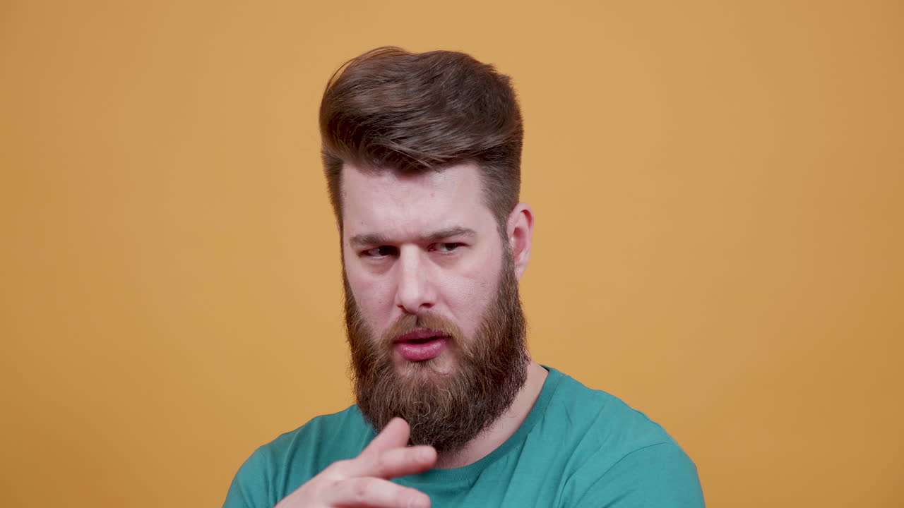 Man with beard thinking