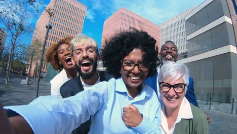 diverse business team taking a selfie outdoors