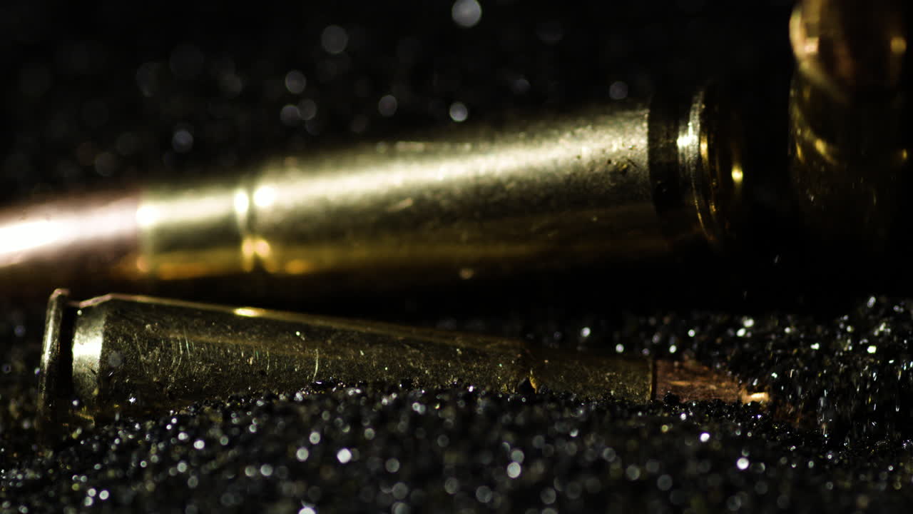 Close-up of Ammunition Cartridges on a Dark, Sparkling Background