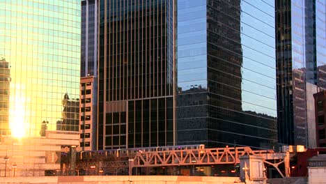 the el train travels over a bridge in front of the chicago skyline 2
