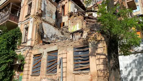 completely destroyed and demolished civilian building by a big rocket in kyiv ukraine, critical war damage in the city capital, russia attacks ukraine, uninhabitable building, half of a house gone, 4k