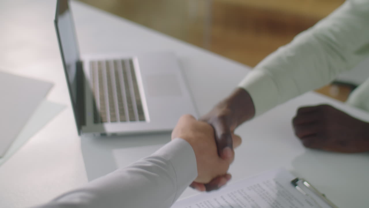 Handshake of Business Partners after Signing Contract