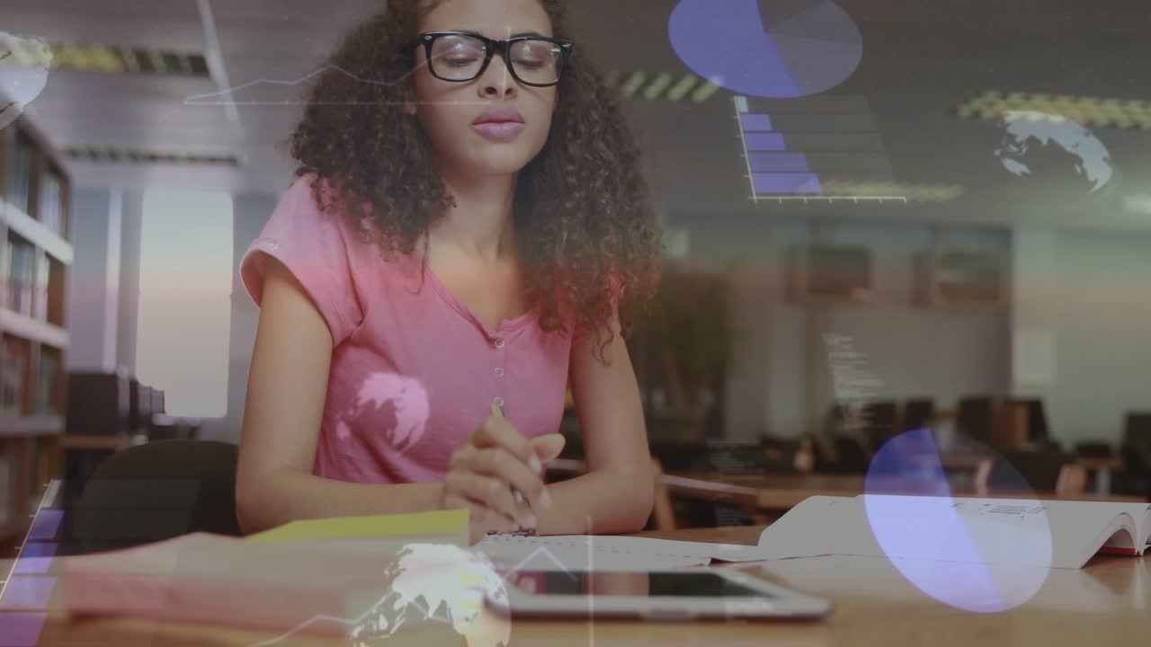 Female student writing notes to study, glancing tablet causing drifting charts and globe icons