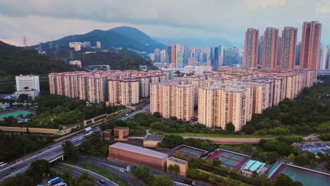 aerial view of hong kong high-rise residential buildings mei foo sun chuen and manhattan hill and commercial buildings in lai chi kok during sunset