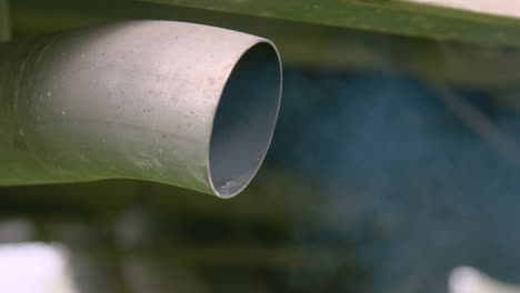 ZOOM-OUT-to-large-exhaust-billowing-thick-smoke-as-the-engine-starts